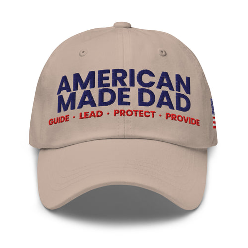 Front of a stone classic dad hat with the embroidered American Made Dad compass