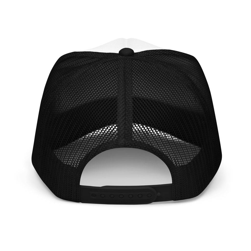 Back of a black and white foam trucker hat showing the mesh and snap closure