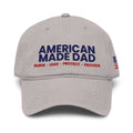 Front of a gray garment washed cap with the embroidered American Made Dad compass