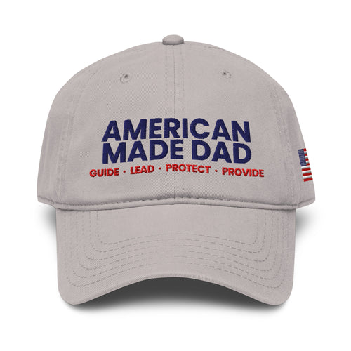 Front of a gray garment washed cap with the embroidered American Made Dad compass