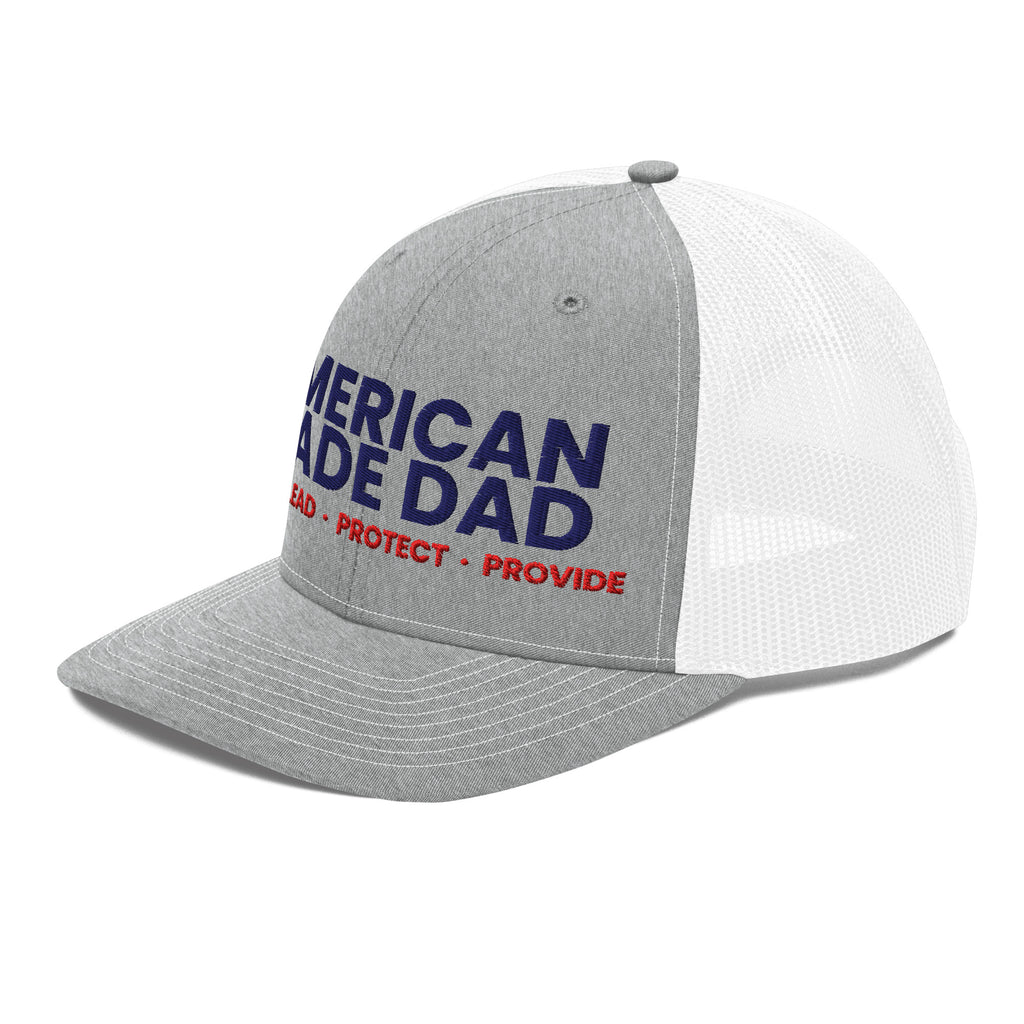 Left angle of a heather grey and white snapback trucker cap with the embroidered compass on the front